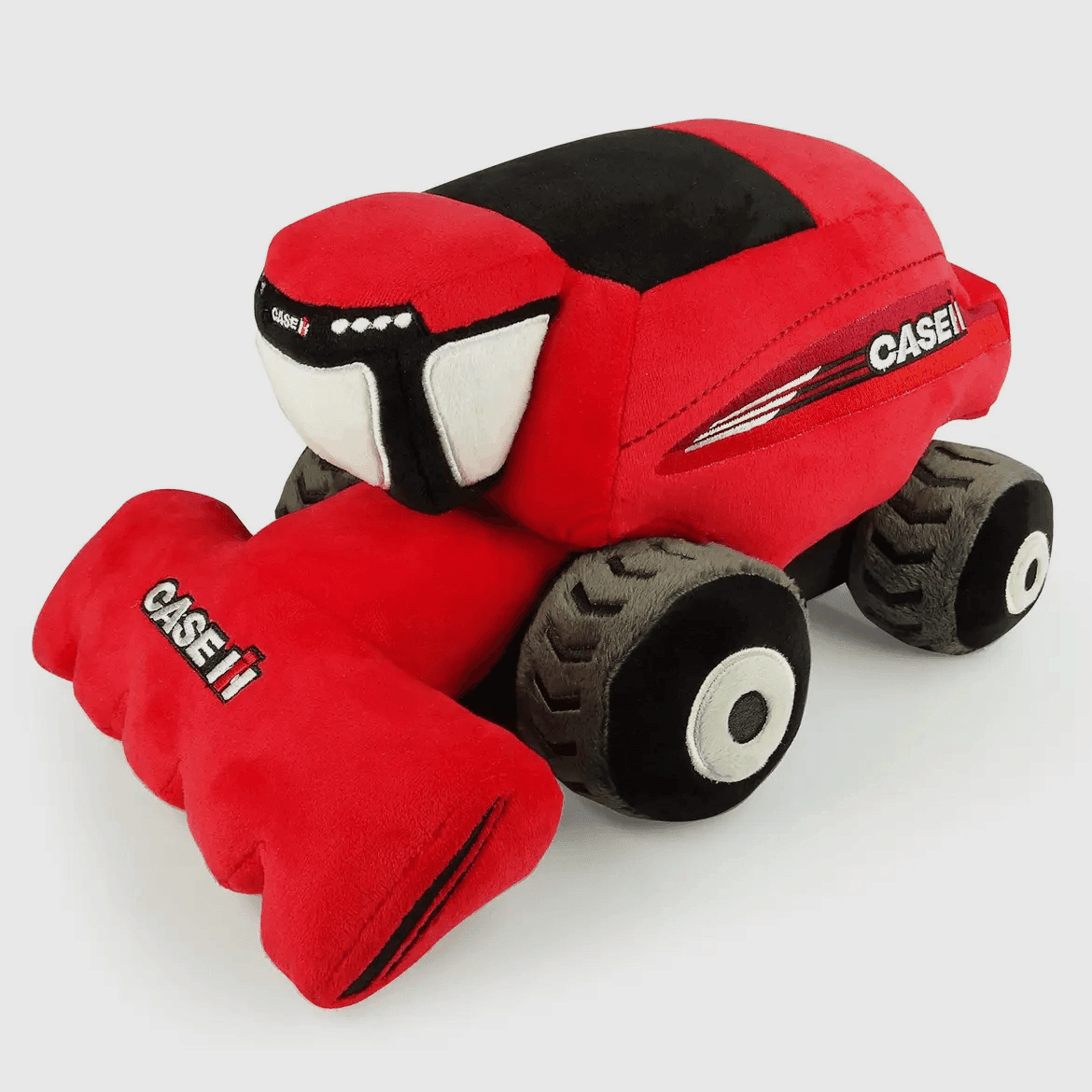 Heritage-inspired plush red combine harvester toy with bold CASE IH details, rugged rural collectible
