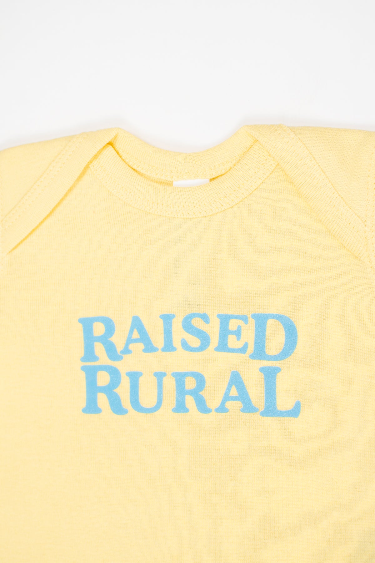 'Raised Rural' Yellow Onesie