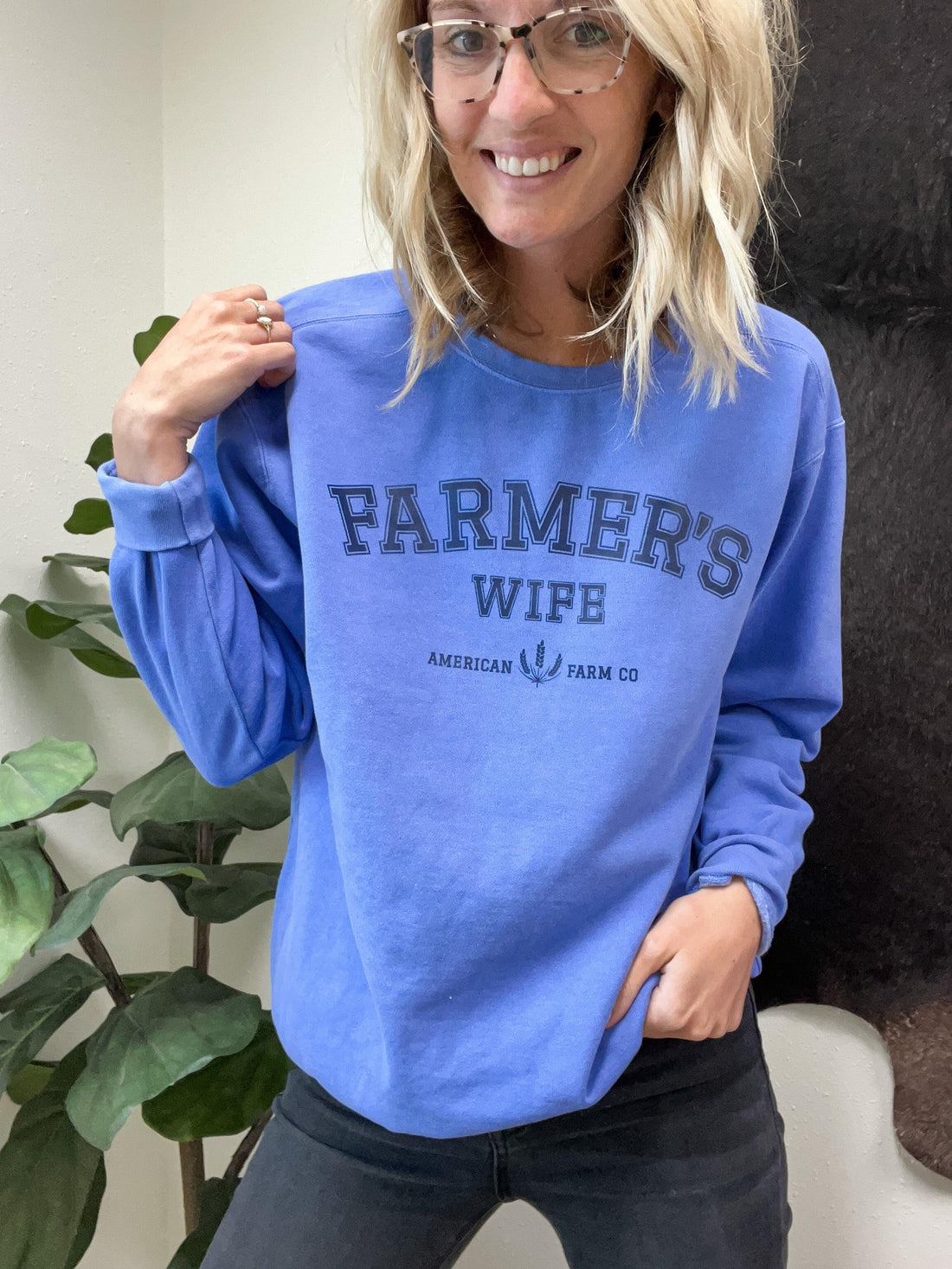 Heritage-inspired blue crewneck sweatshirt with FARMER'S WIFE text, relaxed fit, rural American Farm Company apparel.