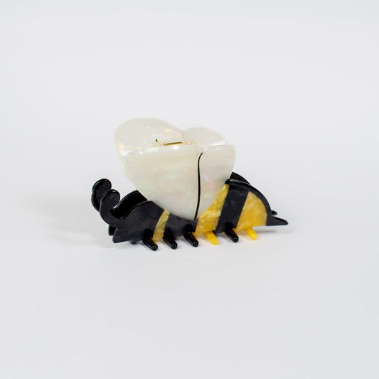 Bee-shaped hair claw with shimmering acrylic wings and yellow-black body, evoking rural farmstead charm by American Farm Company