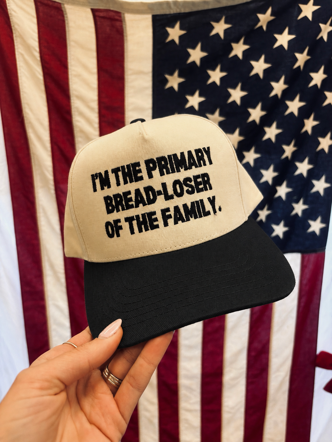 'I'm the Primary Bread-Loser of the Family.' Embroidered Trucker Hat