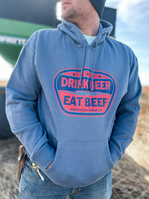 Stylish man in an Eat Beef Hoodie, making a bold fashion statement in the field