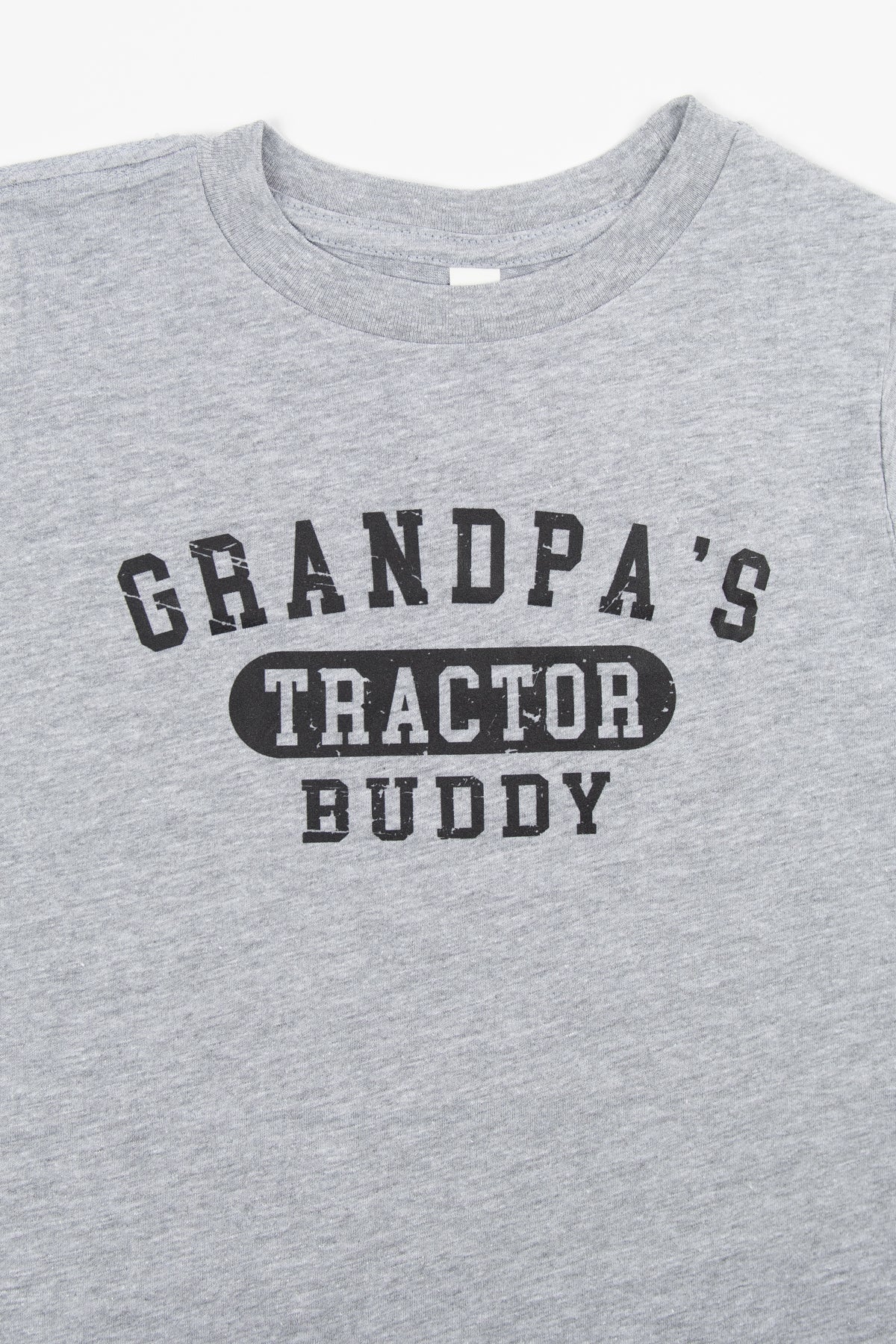 Heather grey youth tee in soft cotton, vintage distressed 'Grandpa's Tractor Buddy' text, rural heritage design by American Farm Company