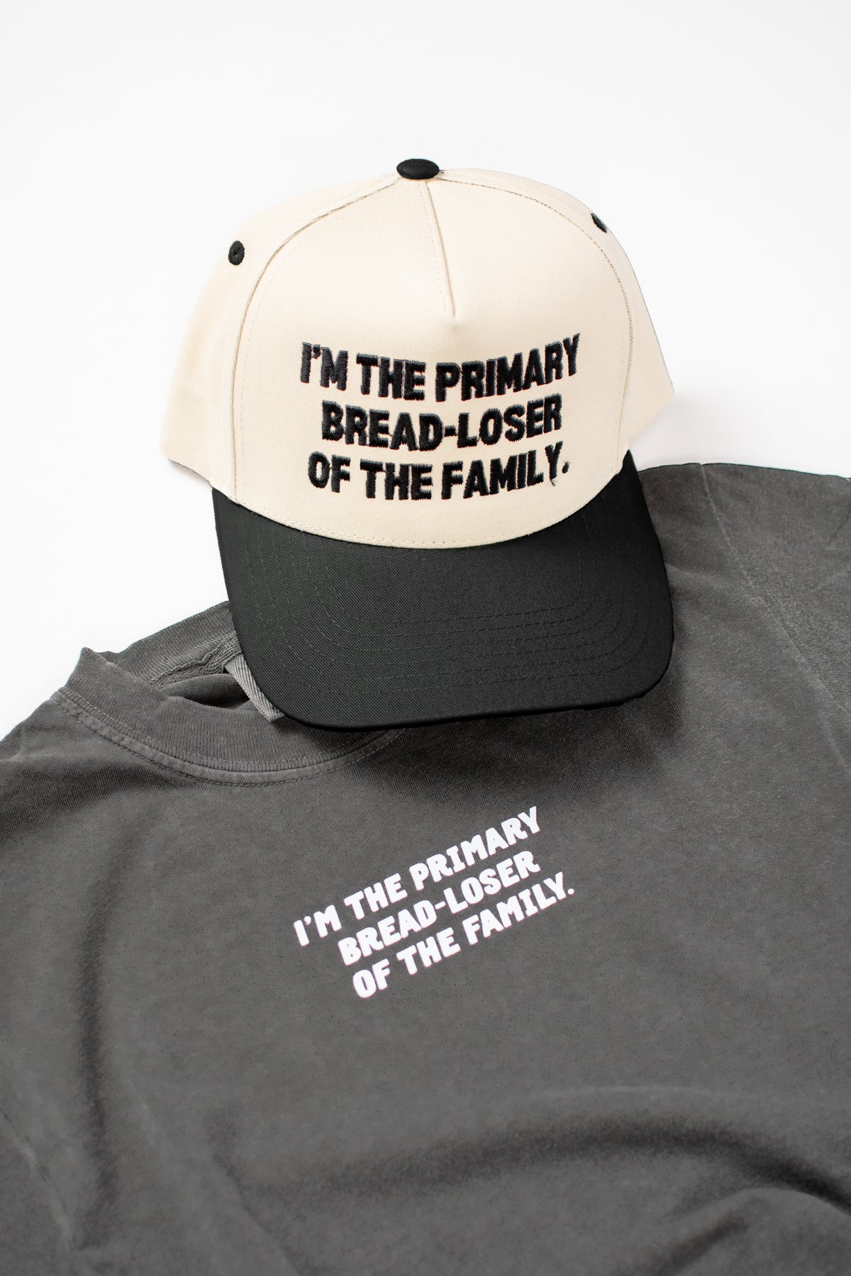 I'm the Primary Bread-Loser of the Family.' Embroidered Trucker Hat