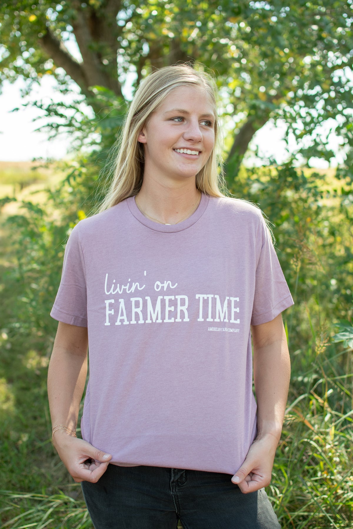 Heritage-inspired mauve relaxed fit tee with 'livin' on FARMER TIME' typography, rural American Farm Company apparel