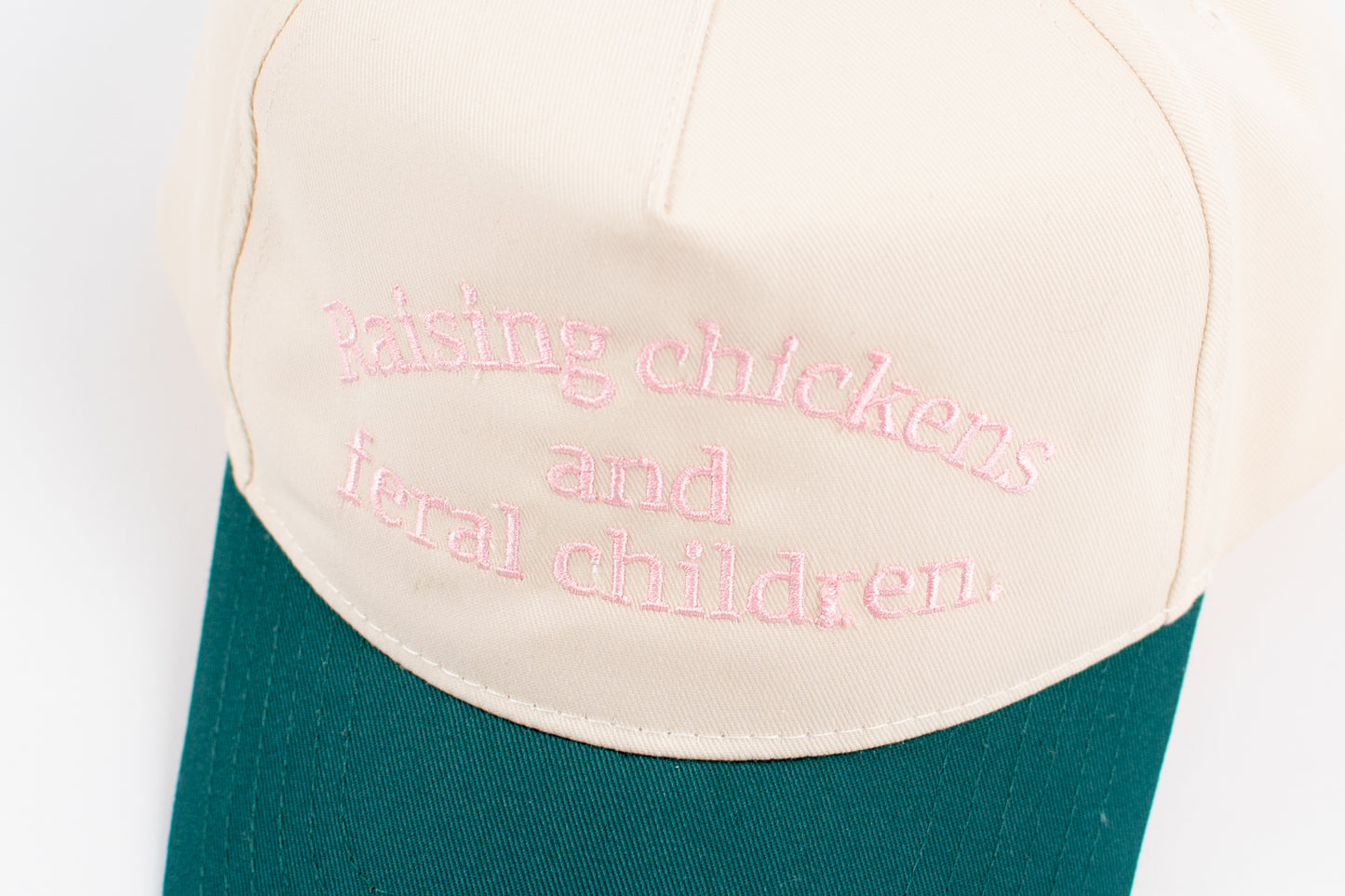 'Raising Chickens and Feral Children.' Embroidered Green Trucker Hat