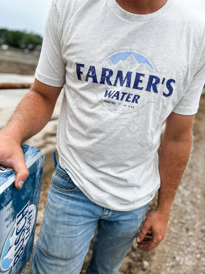 A man wearing Farmers Water Country Tshirt in the field