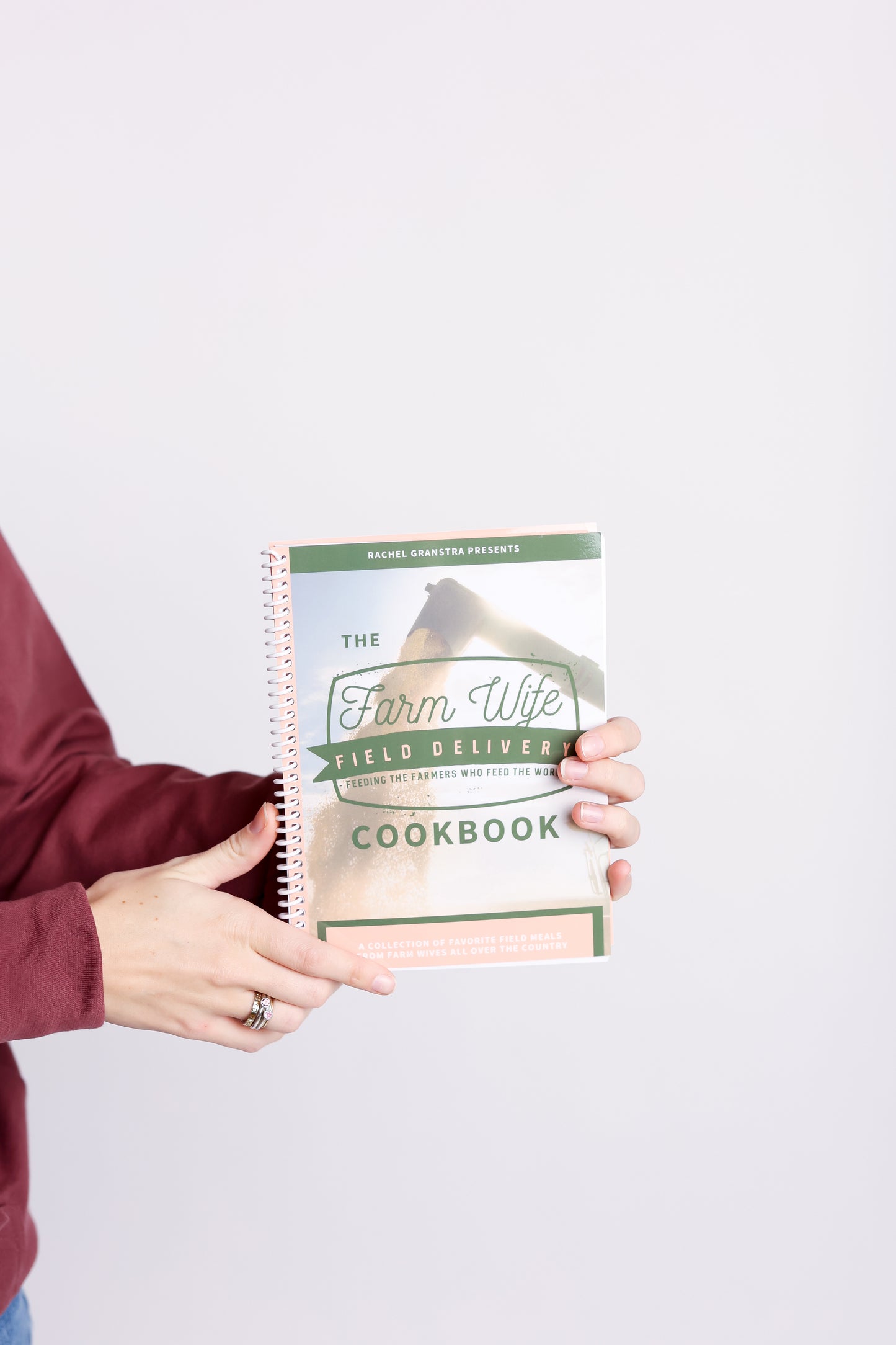 Farm Wife Field Delivery Cookbook with woman holding it