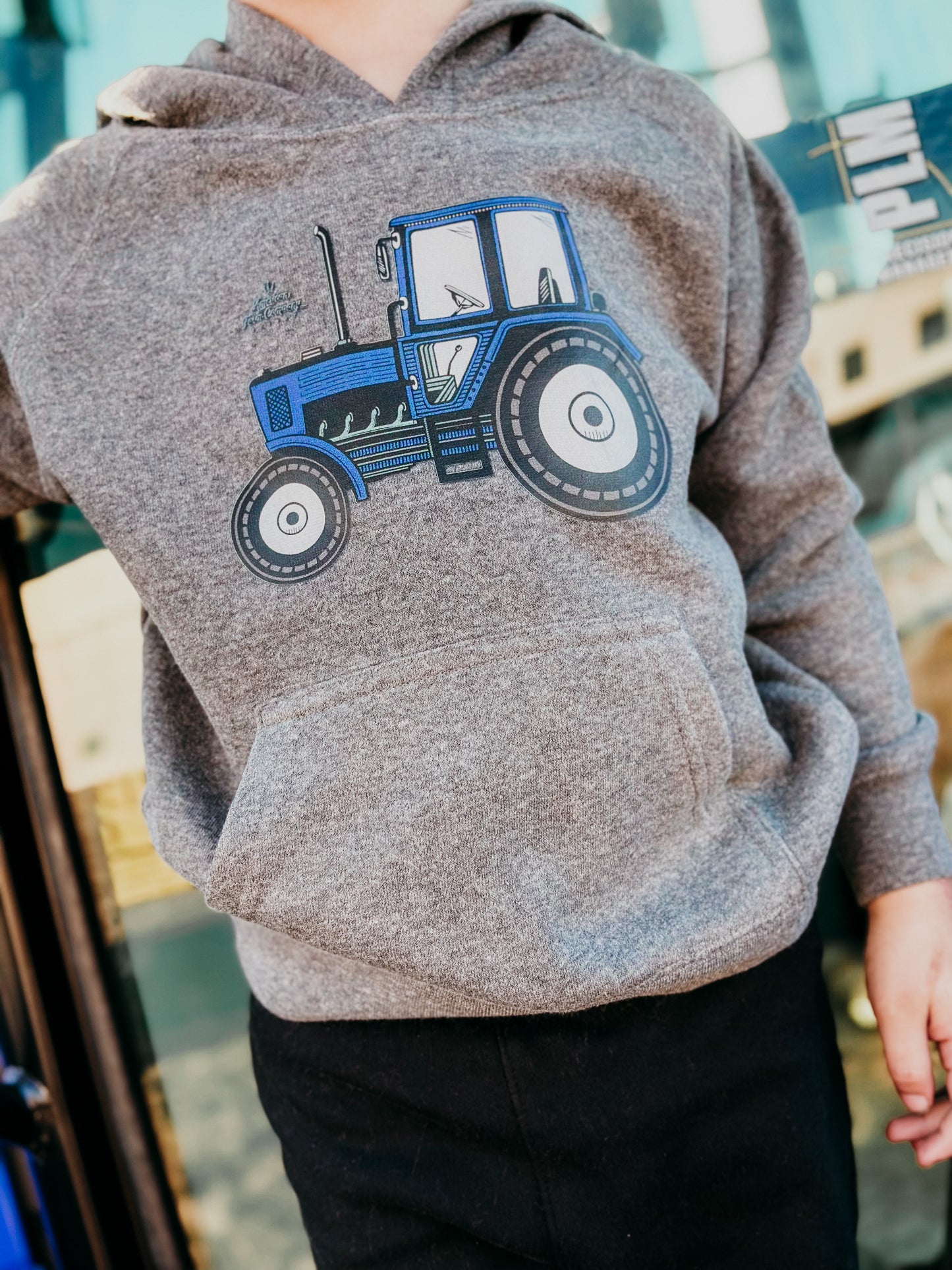 close up of blue tractor hoodie